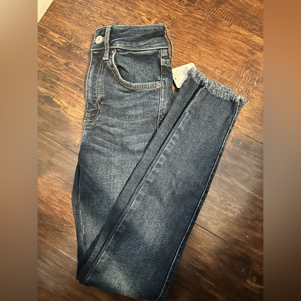 Free people blue jeans with fringed bottom size 24